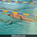 Why Triathletes Should Ditch the Paddles and Focus on Technique