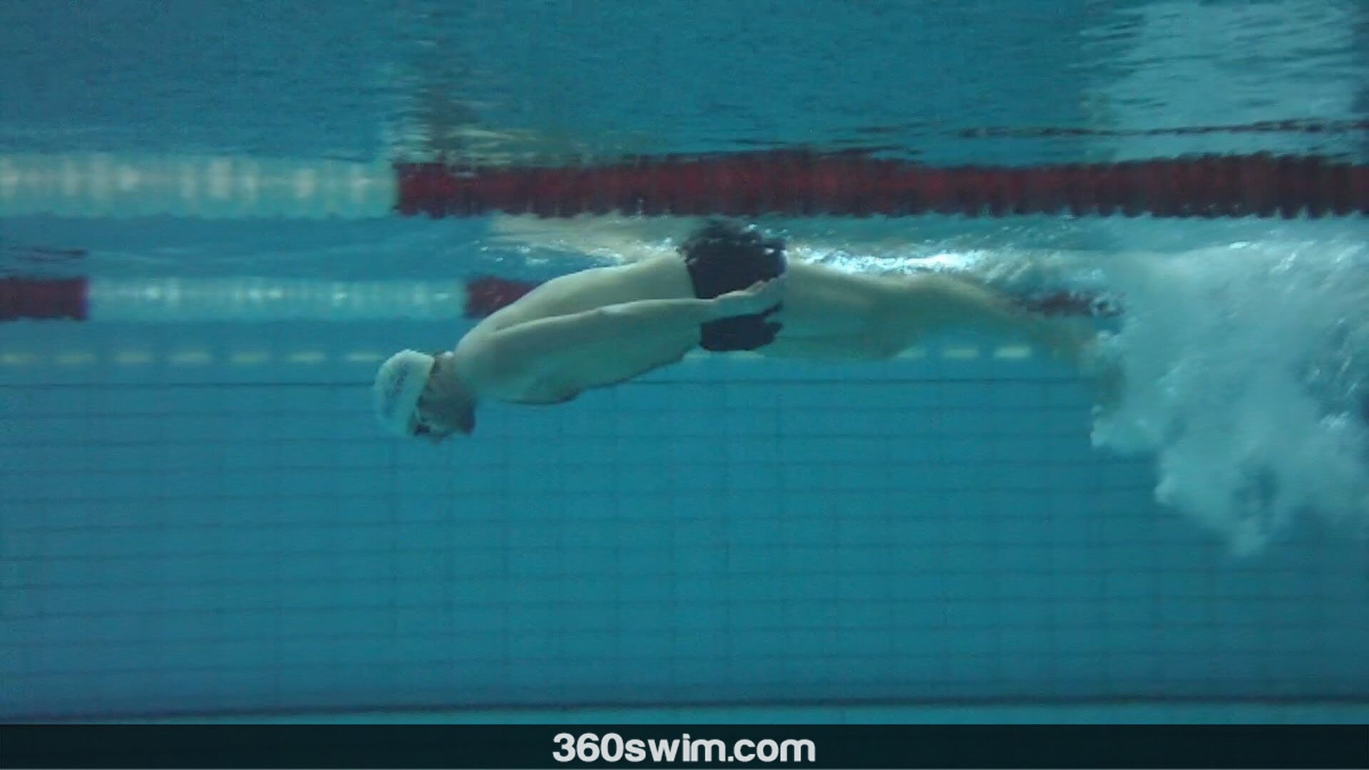 Dive upper body down into the tumble turn