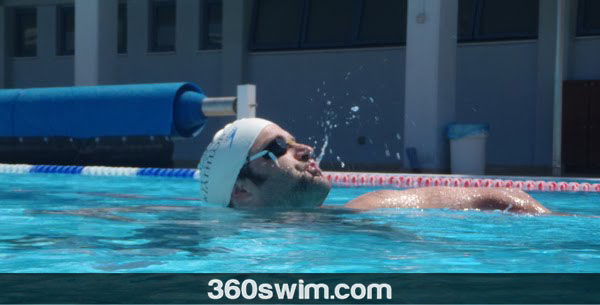 Put goggle strap under your swimming cap